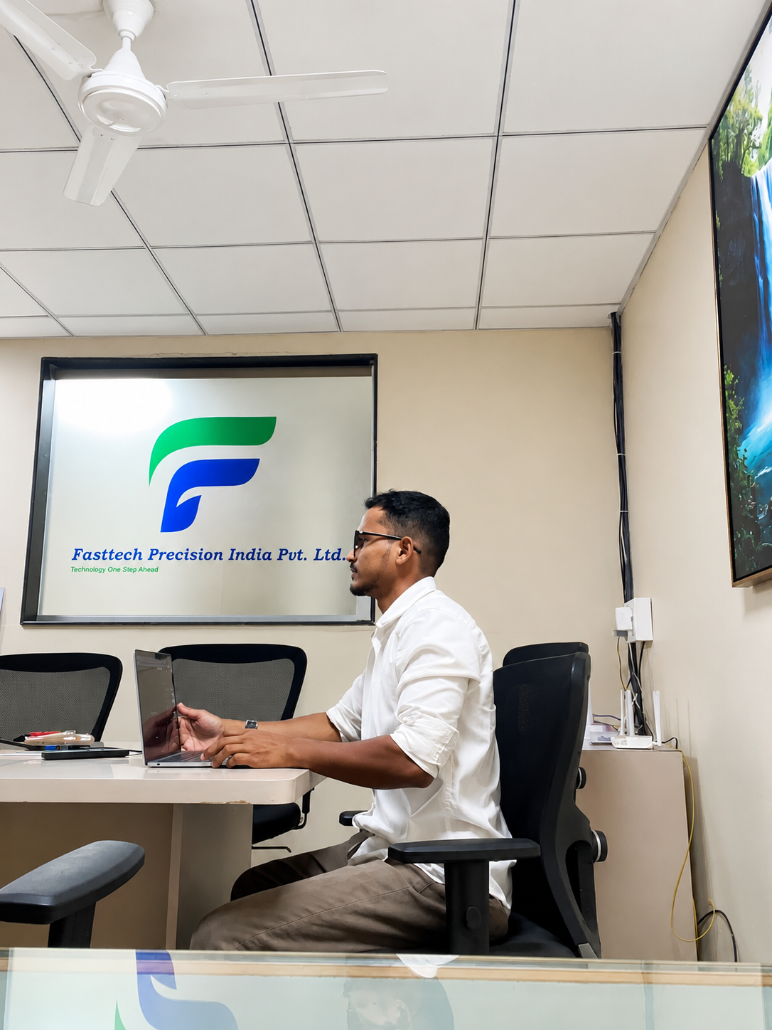Pravin Borse standing in a modern interior